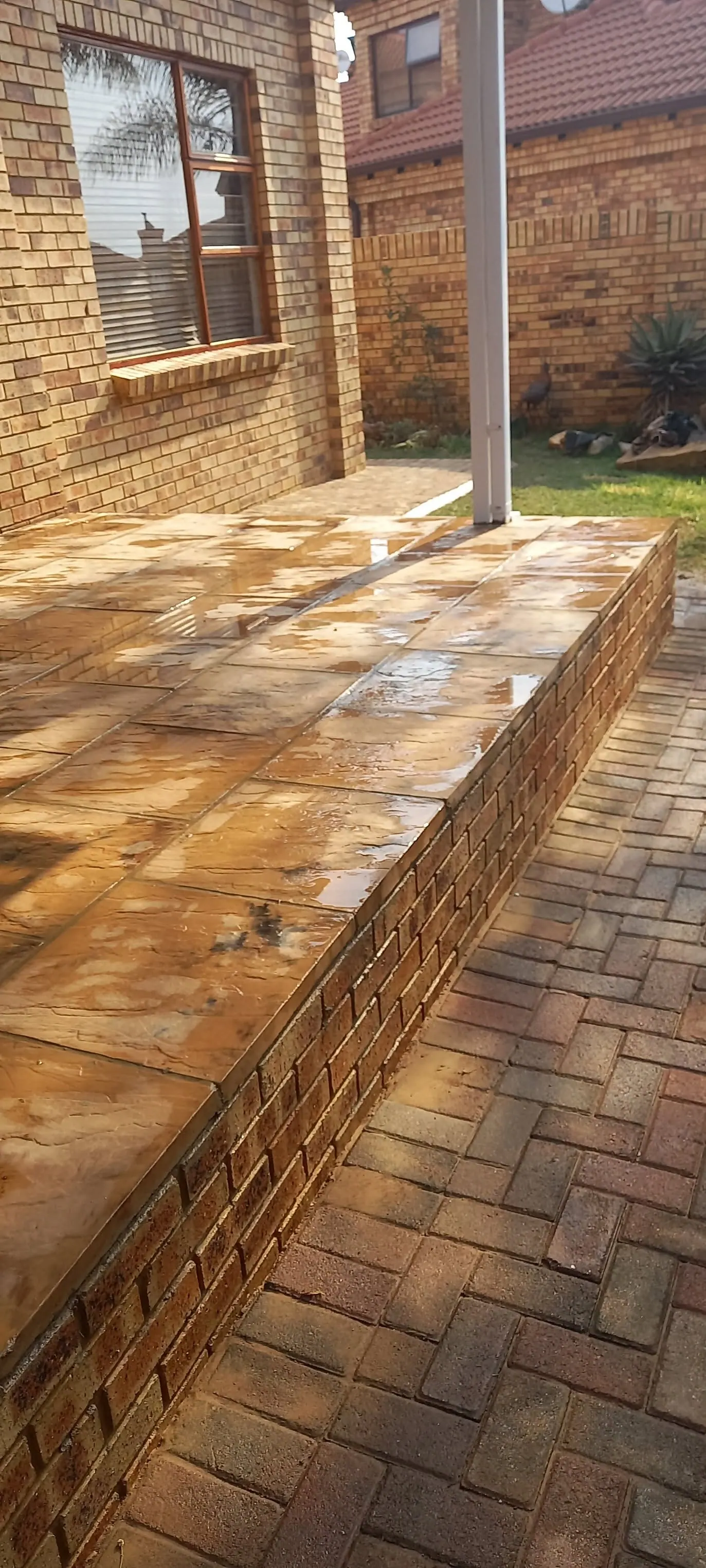 Raised brick-paved platform with a face-brick edge