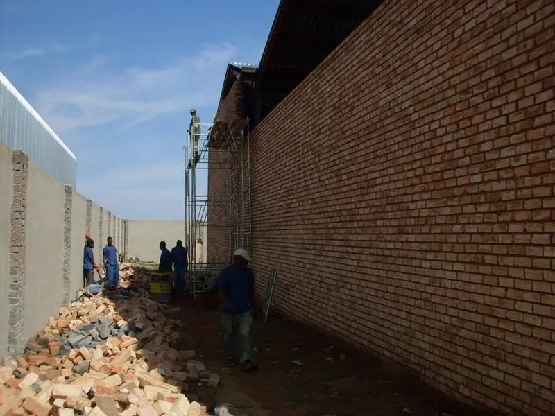 HWK team building a face-brick boundary wall