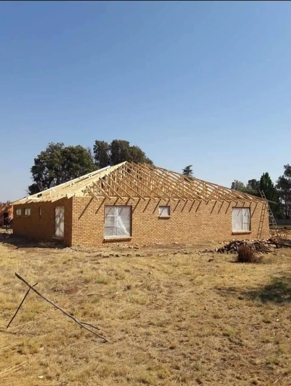 Brick walls built with roof timber in place